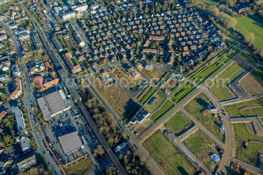 Duisburg from the bird's eye view: Residential area construction site of a mixed development with multi-family houses and single-family houses- New building at the Am Alten Angerbach in the district Huckingen in Duisburg at Ruhrgebiet in the state North Rhine-Westphalia, Germany