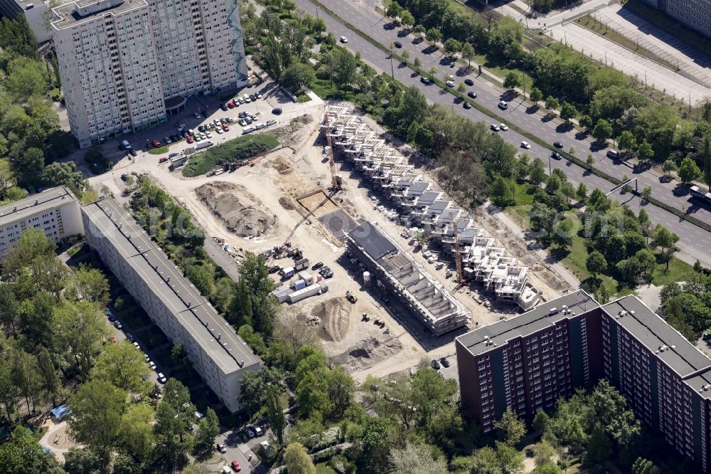 Berlin from above - Construction site of a new residential area of Gensinger Viertel in the Friedrichsfelde part of Lichtenberg in Berlin in Germany. The site is located on Gensinger Strasse and is part of a gentrification and re-development project of the area. Hanseatische Immobilien Treuhand is building single family units, semi-detached houses and town houses