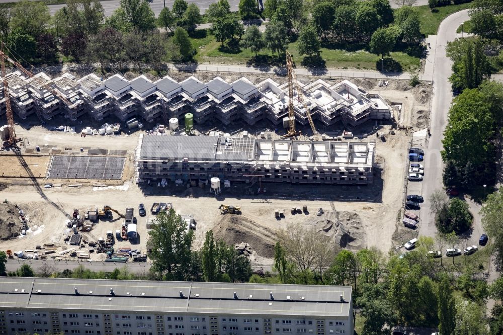 Berlin from above - Construction site of a new residential area of Gensinger Viertel in the Friedrichsfelde part of Lichtenberg in Berlin in Germany. The site is located on Gensinger Strasse and is part of a gentrification and re-development project of the area. Hanseatische Immobilien Treuhand is building single family units, semi-detached houses and town houses