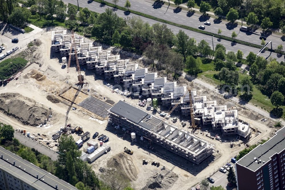 Berlin from above - Construction site of a new residential area of Gensinger Viertel in the Friedrichsfelde part of Lichtenberg in Berlin in Germany. The site is located on Gensinger Strasse and is part of a gentrification and re-development project of the area. Hanseatische Immobilien Treuhand is building single family units, semi-detached houses and town houses