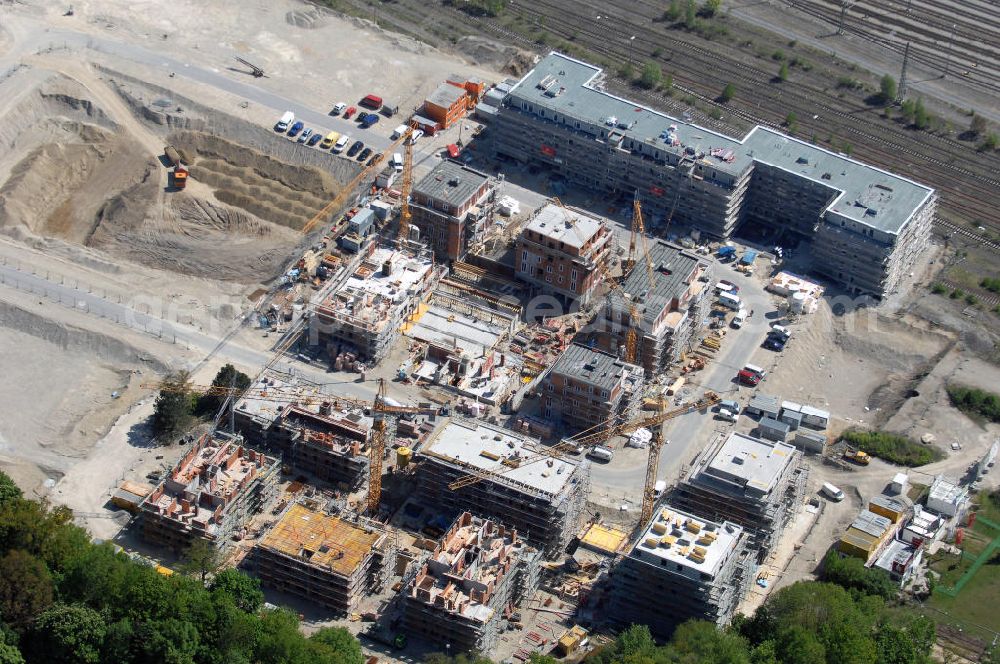 München from the bird's eye view: Baustelle des Wohnneubaugebietes Wotan- Winfriedstrasse am Hirchgarten der Concept Bau - Premier GmbH.