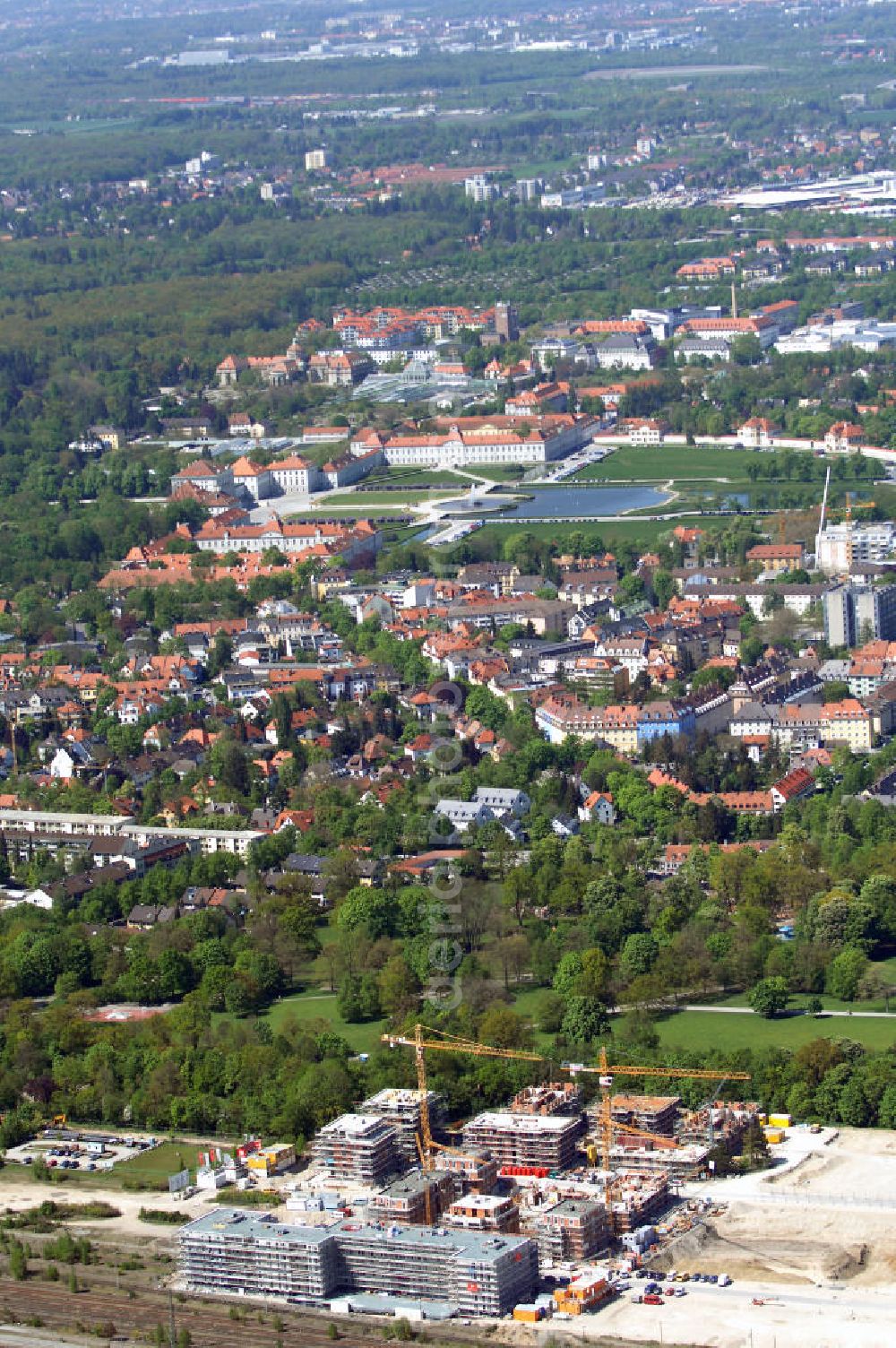 München from the bird's eye view: Baustelle des Wohnneubaugebietes Wotan- Winfriedstrasse am Hirchgarten der Concept Bau - Premier GmbH.