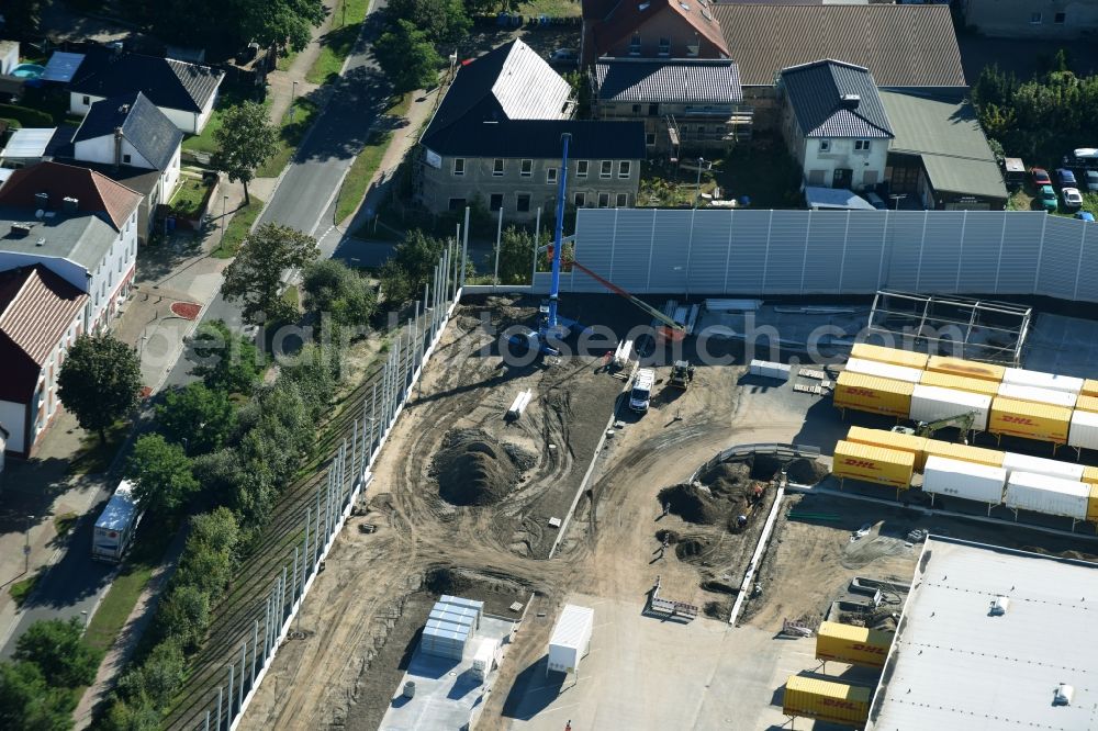 Aerial photograph Rüdersdorf - Construction site for upgrading the Buildings of the DHL logistics hub and distribution center of the Deutsche Post Ruedersdorf in Brandenburg