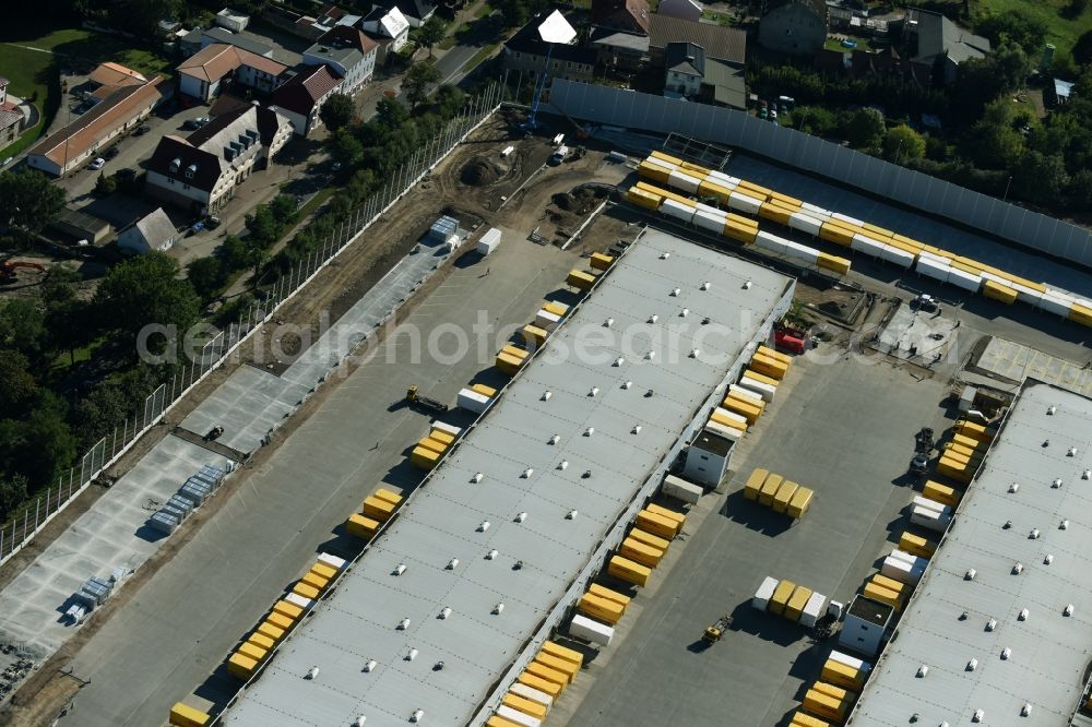 Rüdersdorf from above - Construction site for upgrading the Buildings of the DHL logistics hub and distribution center of the Deutsche Post Ruedersdorf in Brandenburg