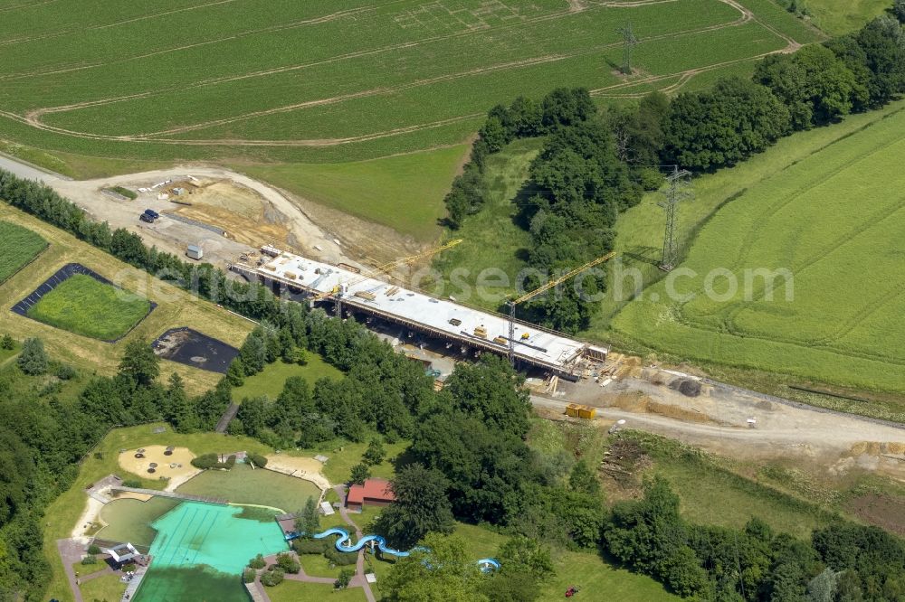 Aerial photograph Mettmann - Construction site of new bridge in Linde Heider Strasse in Mettmann in North Rhine-Westphalia. Building contractor is the company Betam GmbH NL Engineering