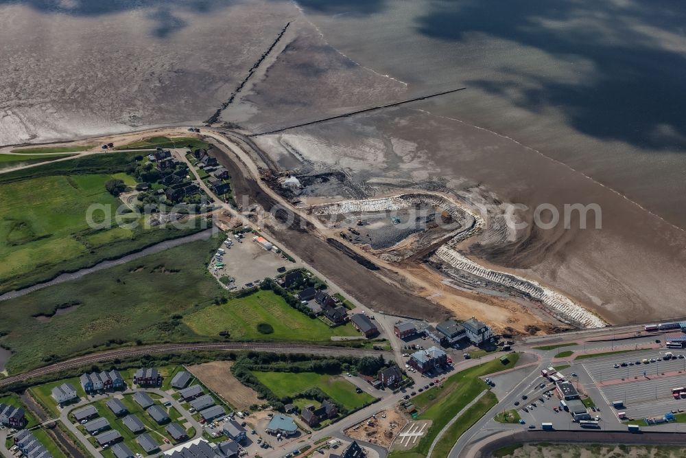 Aerial photograph Dagebüll - Construction site for the new construction of the dyke protection strip Klimadeich on Dagebueller Koog on the street Am Badedeich in Dagebuell North Friesland in the state Schleswig-Holstein, Germany