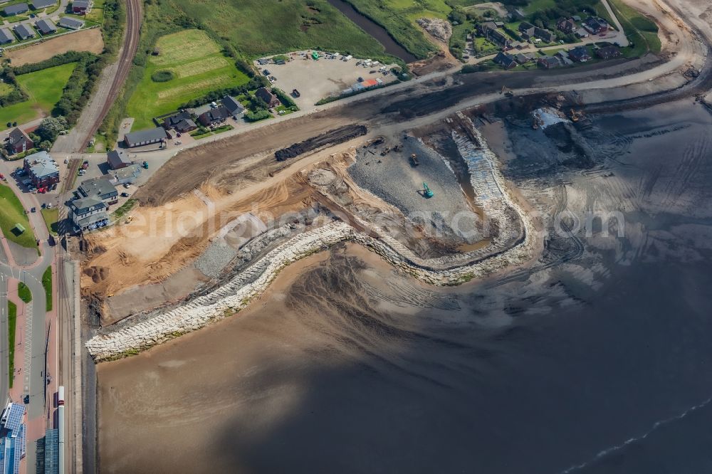 Aerial image Dagebüll - Construction site for the new construction of the dyke protection strip Klimadeich on Dagebueller Koog on the street Am Badedeich in Dagebuell North Friesland in the state Schleswig-Holstein, Germany