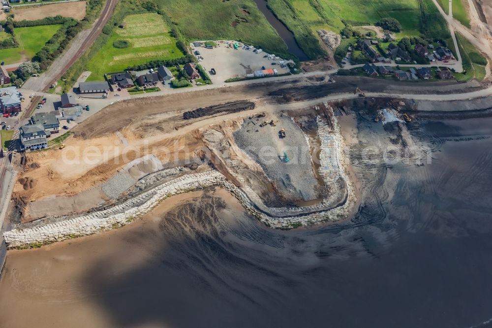 Aerial photograph Dagebüll - Construction site for the new construction of the dyke protection strip Klimadeich on Dagebueller Koog on the street Am Badedeich in Dagebuell North Friesland in the state Schleswig-Holstein, Germany