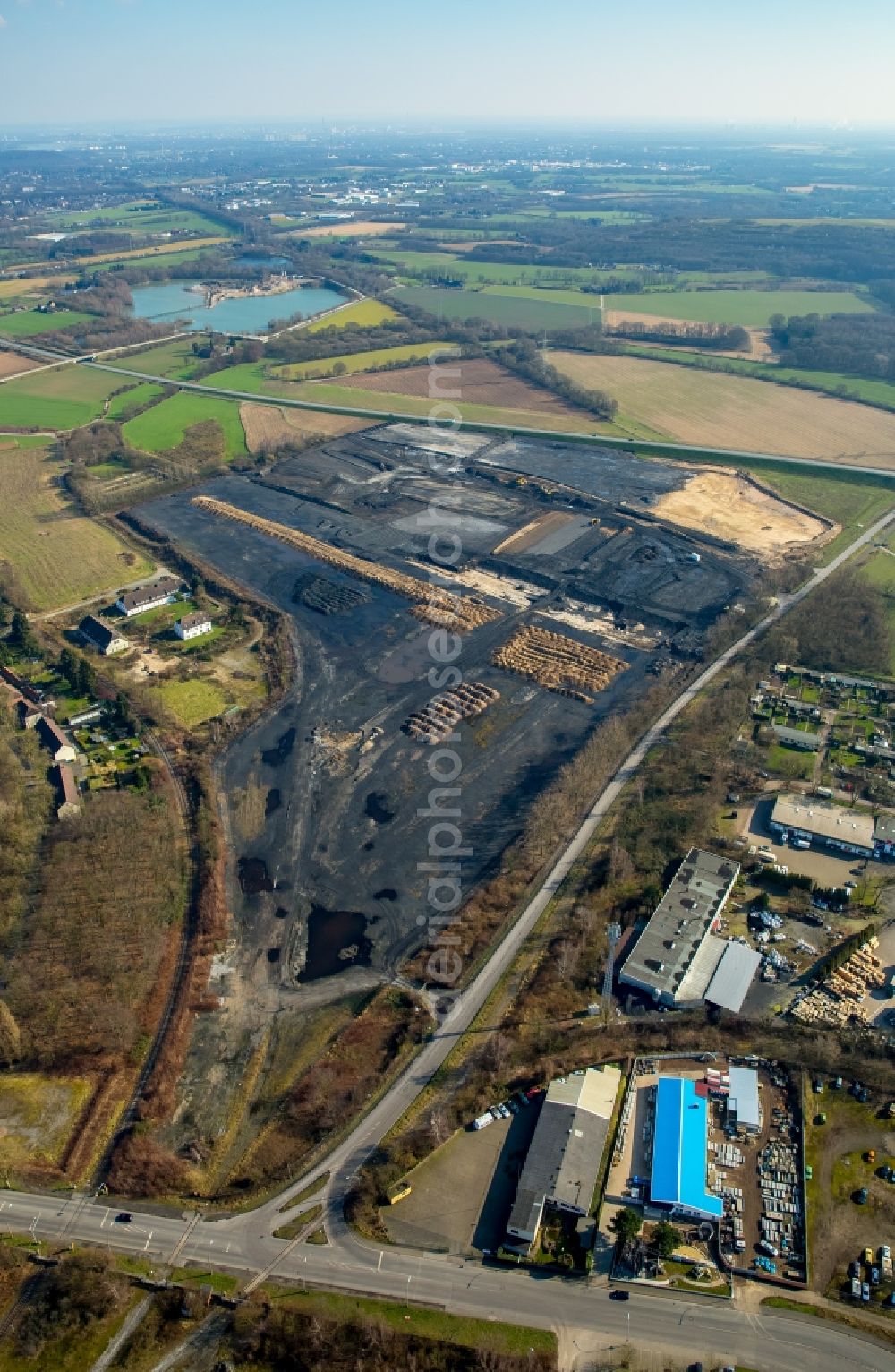 Aerial photograph Kamp-Lintfort - Construction site for the new logistics area logport IV on site of the former coal storage of the coal mine West in Kamp-Lintfort in the state of North Rhine-Westphalia