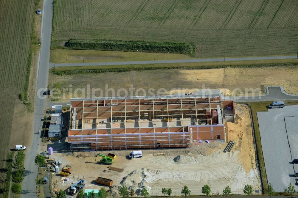 Gütersloh from the bird's eye view: Construction site for the new building eines ALDI Einkaufszentrums an der Herzbrocker Strasse in Guetersloh in the state North Rhine-Westphalia