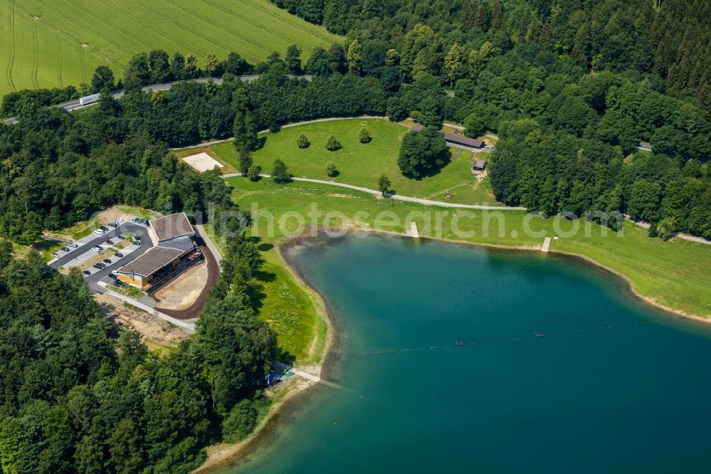 Meschede from the bird's eye view: Construction site for the new building gastronomy H1 am See lokation and restaurant on Hennesee in Meschede in the state North Rhine-Westphalia, Germany