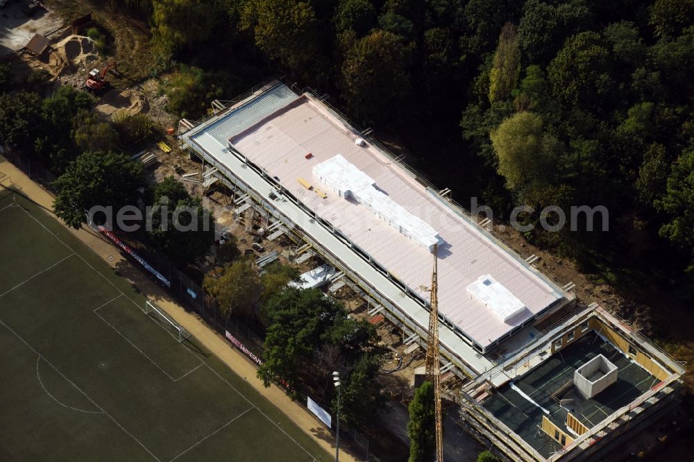 Aerial photograph Berlin - Construction site for the new building on the Hanns-Braun-Strasse - Prinz-Friedrich-Karl-Weg in the Olympiapark, designed by TRU Architekten in Berlin