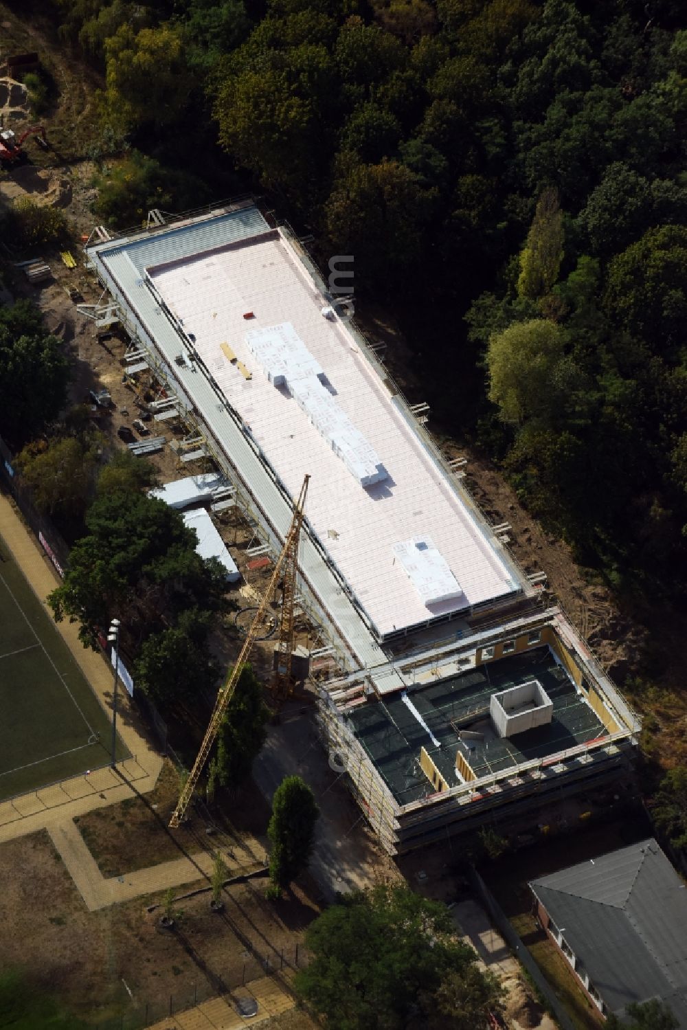 Berlin from the bird's eye view: Construction site for the new building on the Hanns-Braun-Strasse - Prinz-Friedrich-Karl-Weg in the Olympiapark, designed by TRU Architekten in Berlin