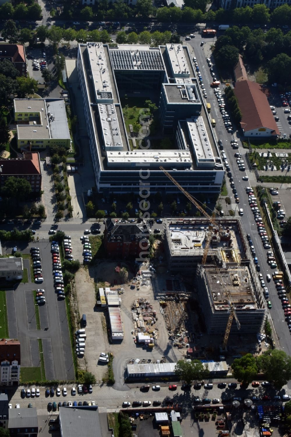 Dresden from the bird's eye view: Construction site of the WOLFF & MUeLLER Holding GmbH & Co. KG for the new building des Biotech-Gruenderzentrum in the street Tatzberg in Dresden in the state Saxony