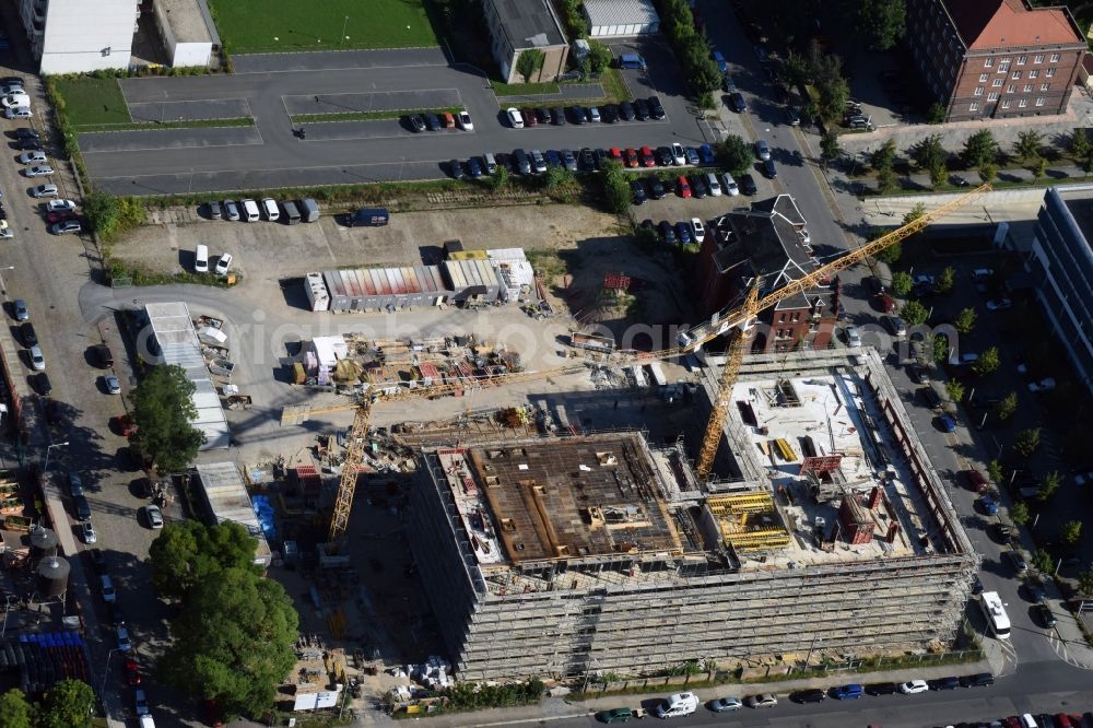 Dresden from the bird's eye view: Construction site of the WOLFF & MUeLLER Holding GmbH & Co. KG for the new building des Biotech-Gruenderzentrum in the street Tatzberg in Dresden in the state Saxony