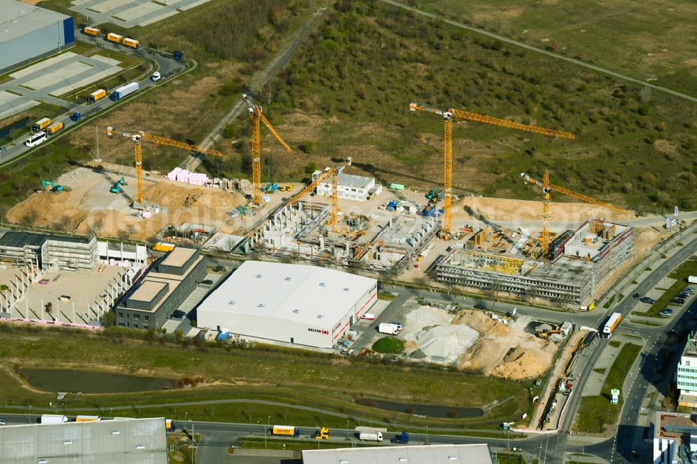 Schönefeld from the bird's eye view: Construction site for the new building of an office building - ensemble on Mizarstrasse in Schoenefeld in the state Brandenburg, Germany