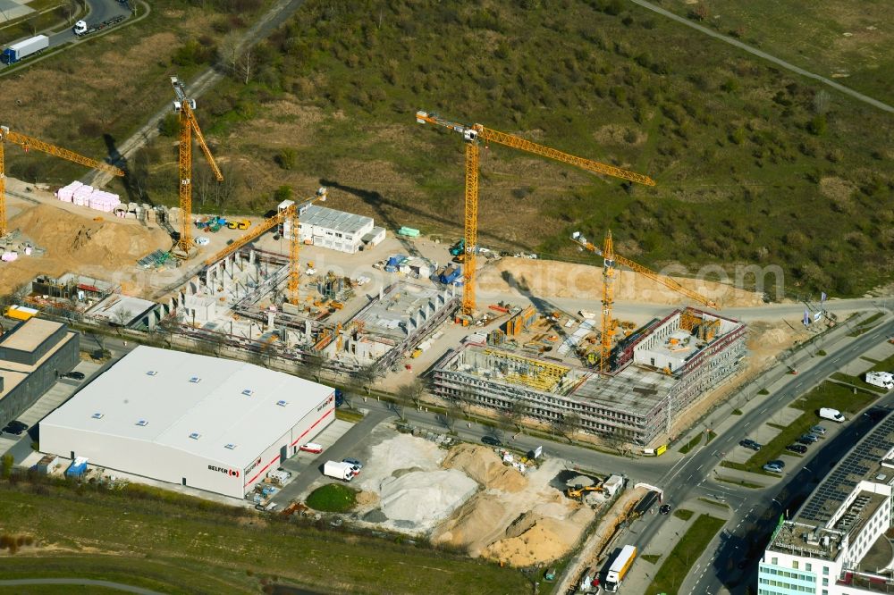 Schönefeld from the bird's eye view: Construction site for the new building of an office building - ensemble on Mizarstrasse in Schoenefeld in the state Brandenburg, Germany