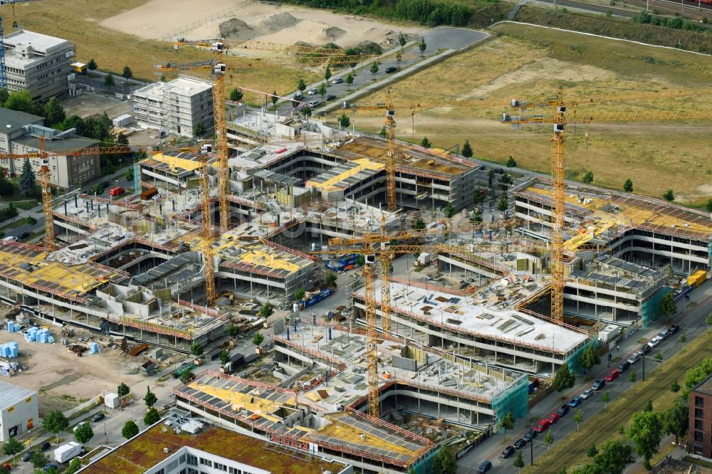 Berlin from the bird's eye view: Construction site to build a new office and commercial building Allianz Campus Berlin in the district Johannisthal - Adlershof in Berlin