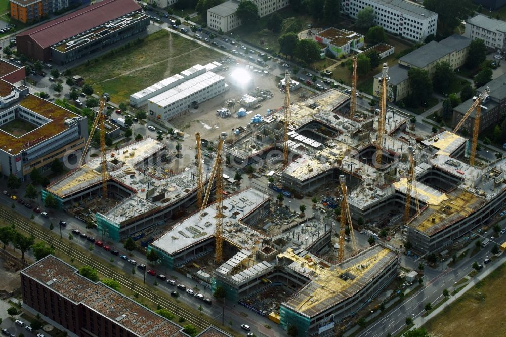 Berlin from the bird's eye view: Construction site to build a new office and commercial building Allianz Campus Berlin in the district Johannisthal - Adlershof in Berlin