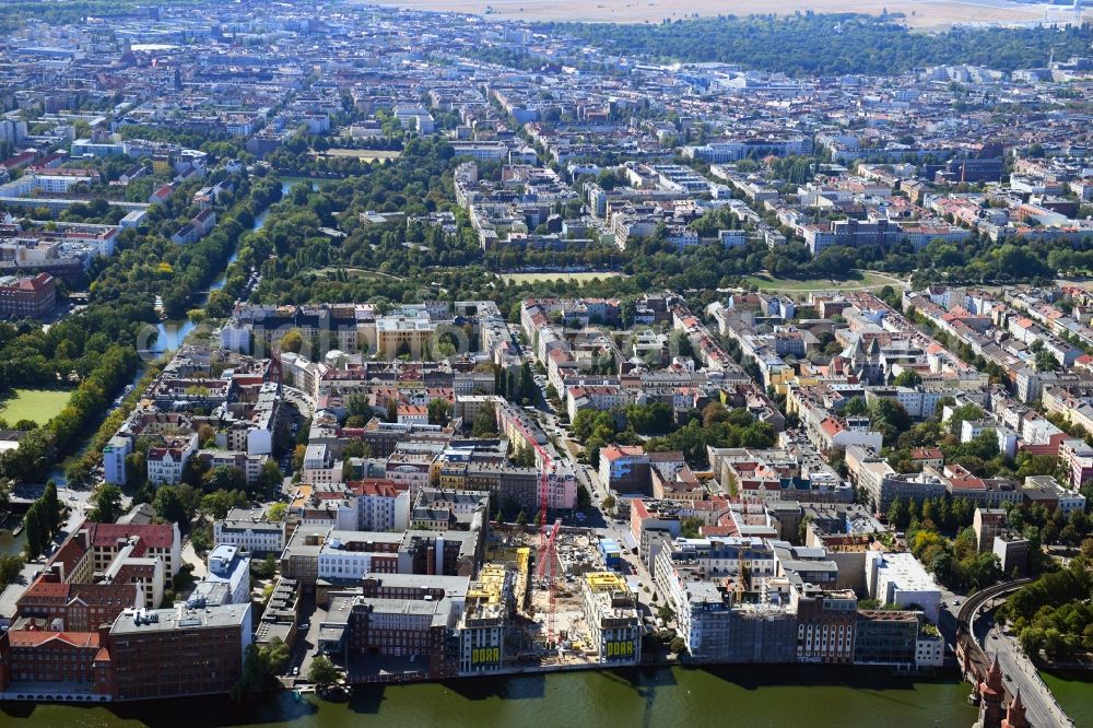 Berlin from the bird's eye view: Construction site to build a new office and commercial building CUVRY CAMPUS on Cuvrystrasse - Schlesische Strasse in the district Kreuzberg in Berlin, Germany