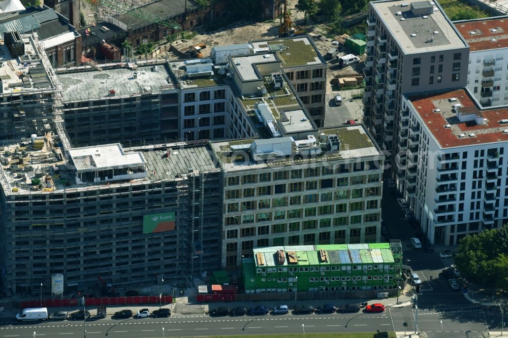 Berlin from above - Construction site to build a new office and commercial building durch die BAM Deutschland AG an der Muehlenstrasse - Am Postbahnhof destrict Friedrichshain in Berlin