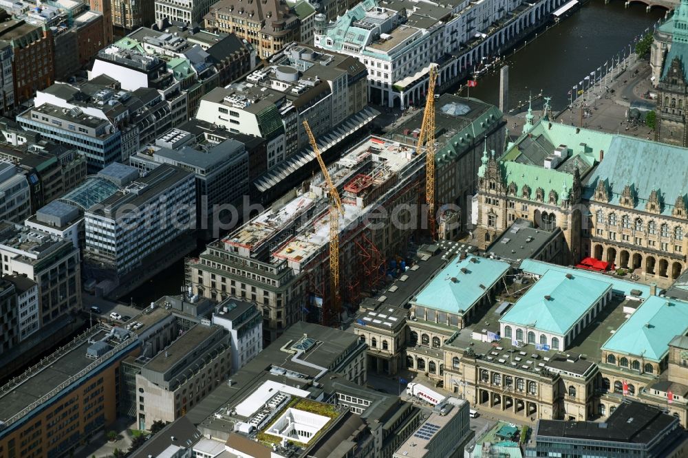 Hamburg from the bird's eye view: Construction site to build a new office and commercial building on Alter Wall in Hamburg, Germany