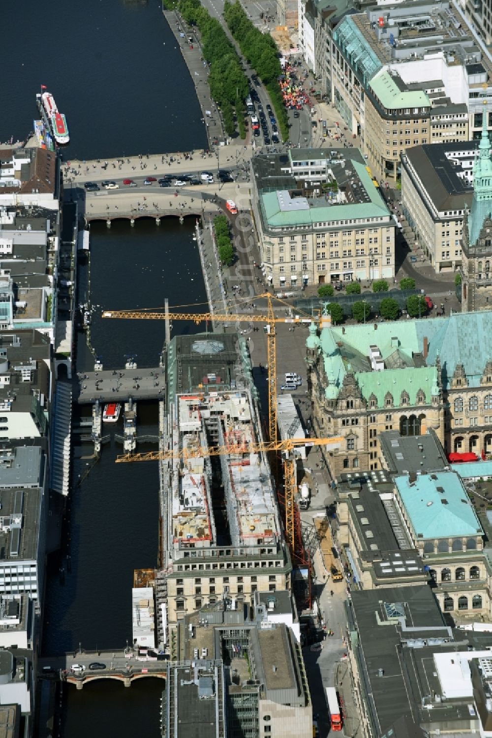 Hamburg from the bird's eye view: Construction site to build a new office and commercial building on Alter Wall in Hamburg, Germany