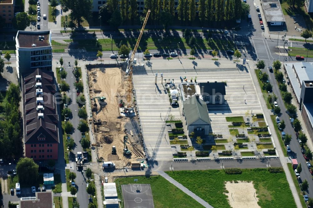 Aerial photograph Berlin - Construction site to build a new office and commercial building along the Erich-Thilo-Strasse in Berlin, Germany