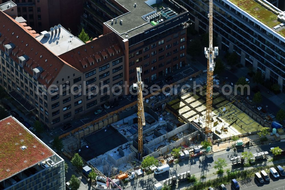 Berlin from the bird's eye view: Construction site to build a new office and commercial building on Gutenbergstrasse corner Hannah-Karminski-Strasse in Berlin, Germany