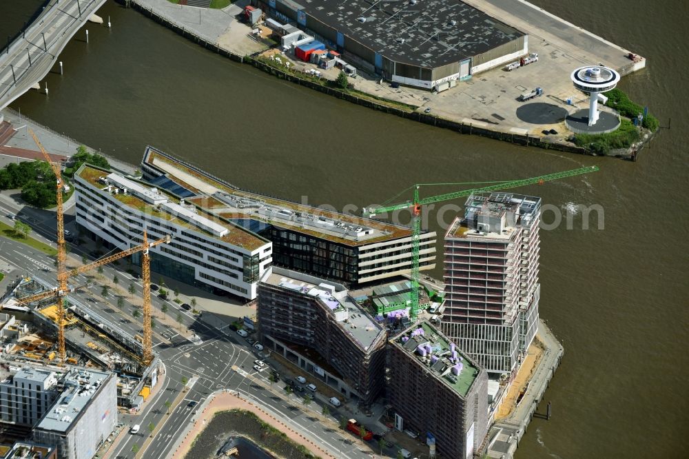 Hamburg from the bird's eye view: Construction site to build a new office and commercial building Intelligent Quarters in of Hafen City in Hamburg, Germany