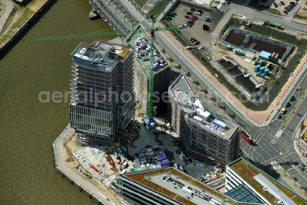 Hamburg from the bird's eye view: Construction site to build a new office and commercial building Intelligent Quarters in of Hafen City in Hamburg, Germany