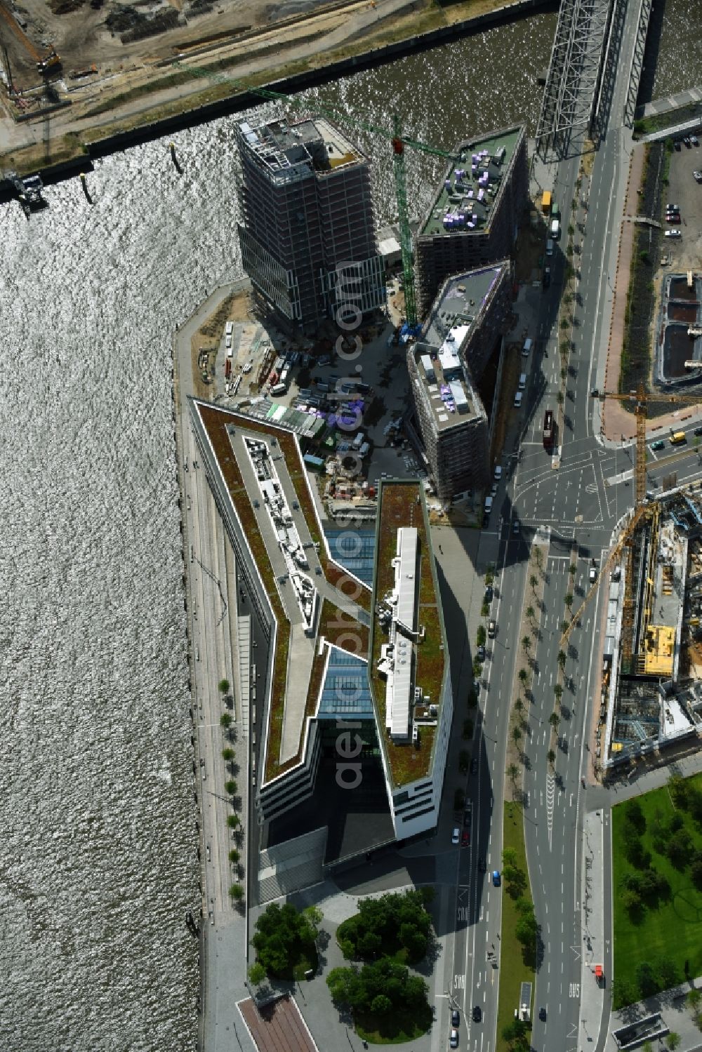 Hamburg from the bird's eye view: Construction site to build a new office and commercial building Intelligent Quarters in of Hafen City in Hamburg, Germany