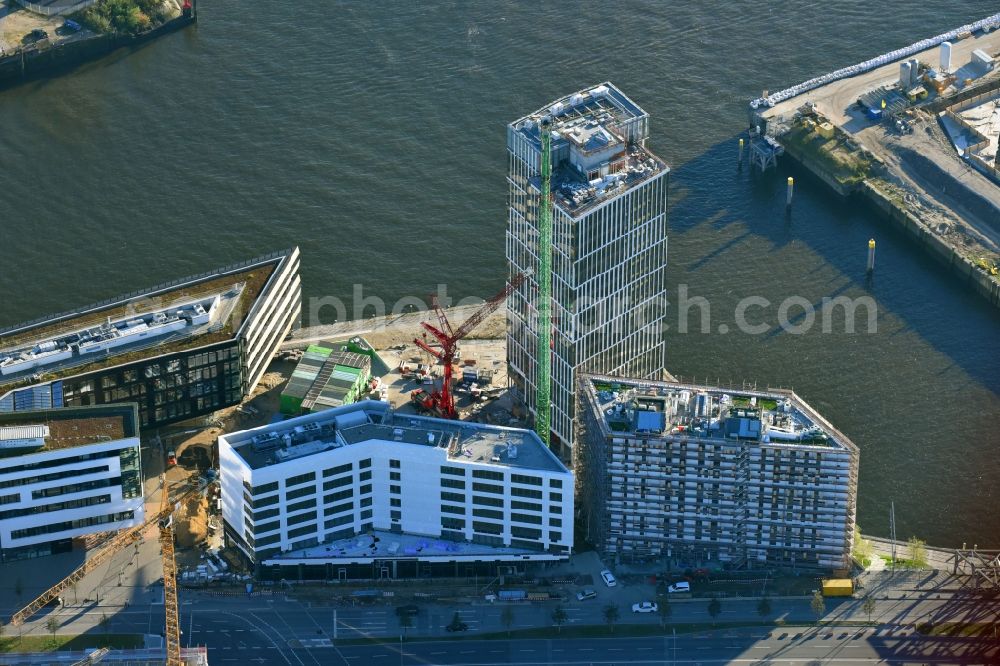 Hamburg from the bird's eye view: Construction site to build a new office and commercial building Intelligent Quarters in of Hafen City in Hamburg, Germany