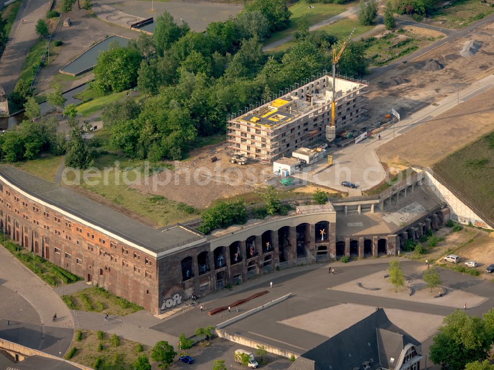 Aerial image Bochum - Construction site to build a new office and commercial building Kultur Ruhr GmbH in the West Park in Bochum at Ruhrgebiet in the state North Rhine-Westphalia. Nearby the ruin of the former entrance of the Krupp grounds