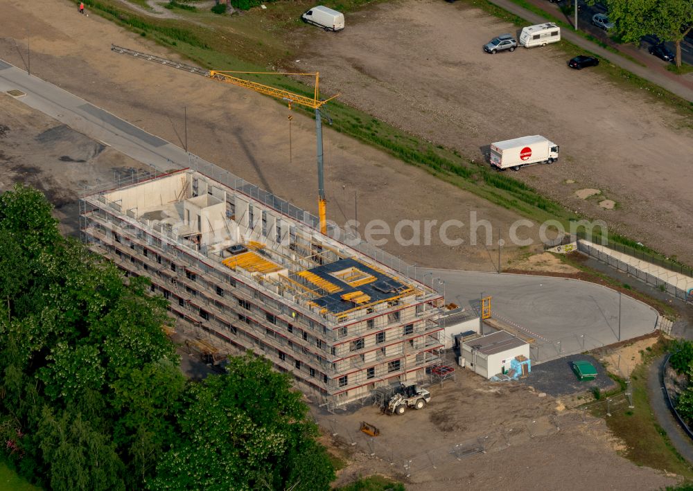 Aerial image Bochum - Construction site to build a new office and commercial building Kultur Ruhr GmbH in the West Park in Bochum at Ruhrgebiet in the state North Rhine-Westphalia. Nearby the ruin of the former entrance of the Krupp grounds