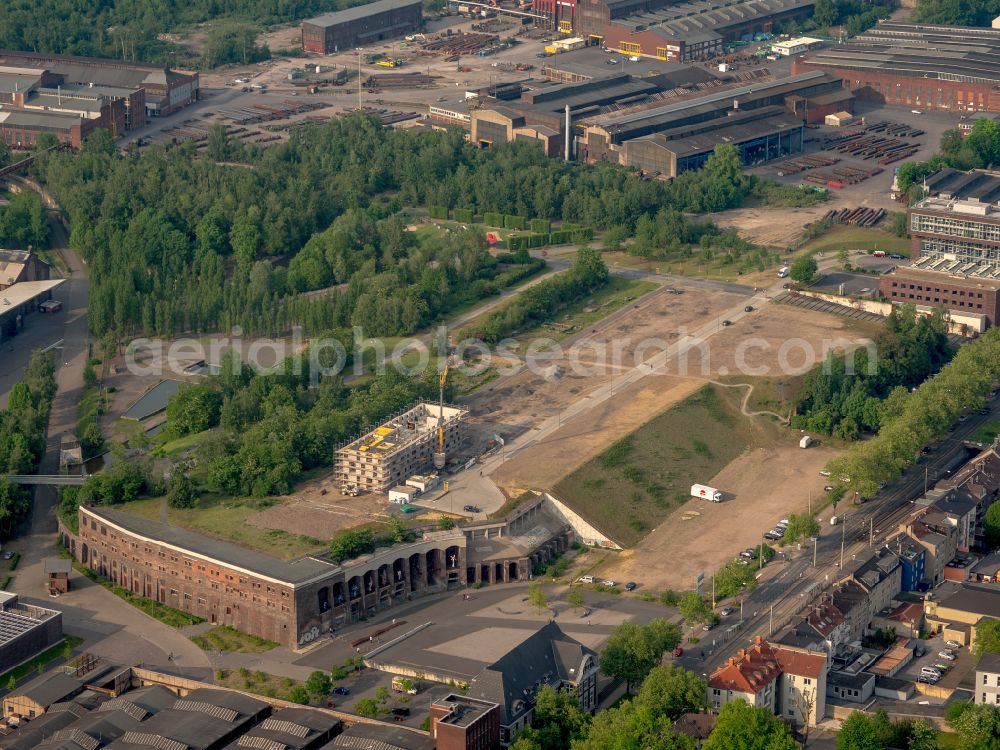 Aerial photograph Bochum - Construction site to build a new office and commercial building Kultur Ruhr GmbH in the West Park in Bochum at Ruhrgebiet in the state North Rhine-Westphalia. Nearby the ruin of the former entrance of the Krupp grounds