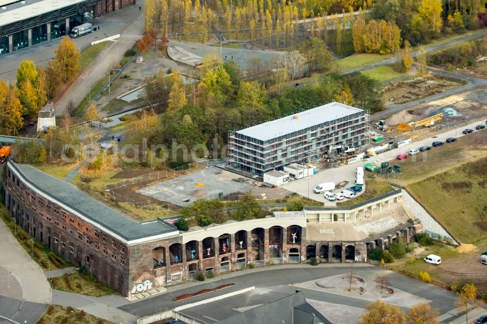 Aerial image Bochum - Construction site to build a new office and commercial building Kultur Ruhr GmbH in the West Park in Bochum in the state North Rhine-Westphalia. Nearby the ruin of the former entrance of the Krupp grounds