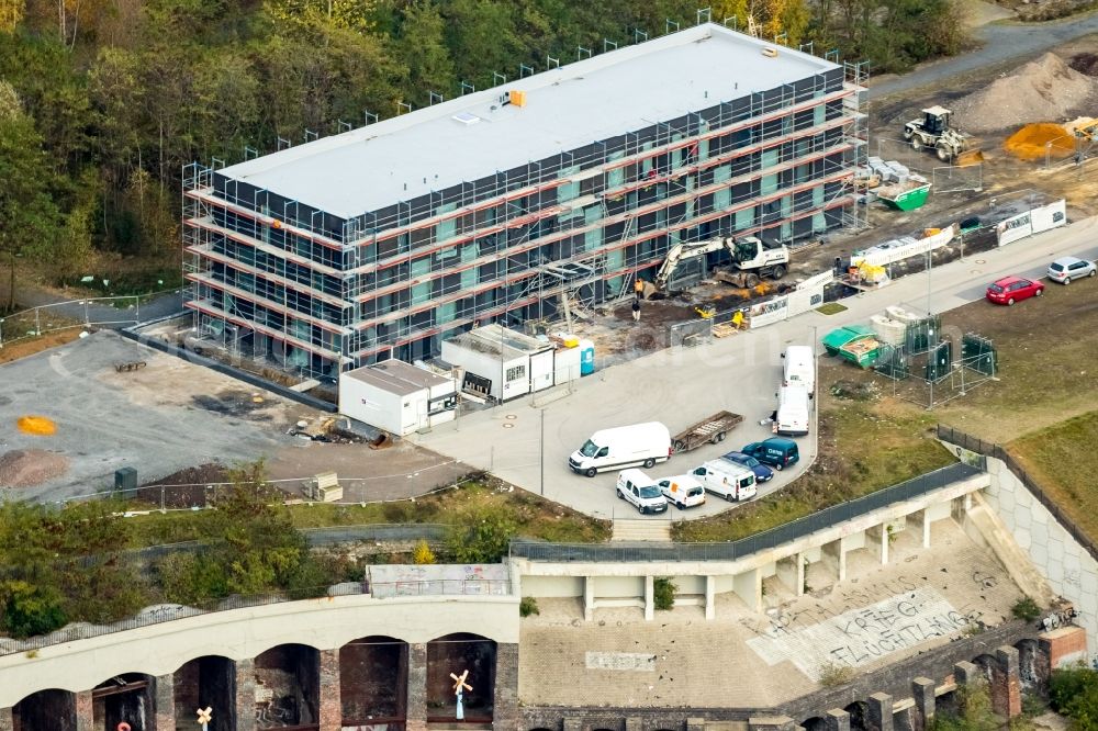 Aerial photograph Bochum - Construction site to build a new office and commercial building Kultur Ruhr GmbH in the West Park in Bochum in the state North Rhine-Westphalia. Nearby the ruin of the former entrance of the Krupp grounds