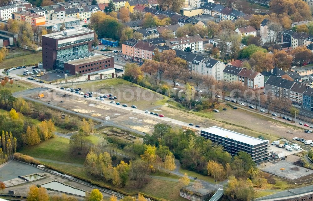 Bochum from the bird's eye view: Construction site to build a new office and commercial building Kultur Ruhr GmbH in the West Park in Bochum in the state North Rhine-Westphalia. Nearby the ruin of the former entrance of the Krupp grounds