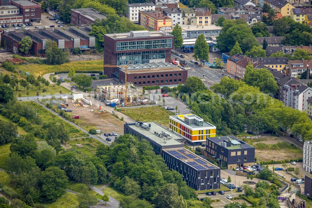 Aerial photograph Bochum - Construction site to build a new office and commercial building Kultur Ruhr GmbH in the West Park in Bochum at Ruhrgebiet in the state North Rhine-Westphalia. Nearby the ruin of the former entrance of the Krupp grounds