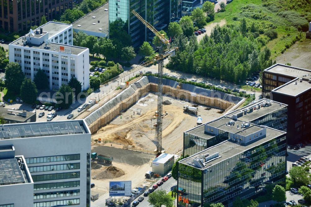 Aerial image Eschborn - Construction site for new office and retail building in the industrial area New Wave I Eschborn in the state of Hesse. The Phoenix Real Estate Development GmbH built by the construction company Zechbau Zech Group GmbH is a modern office building