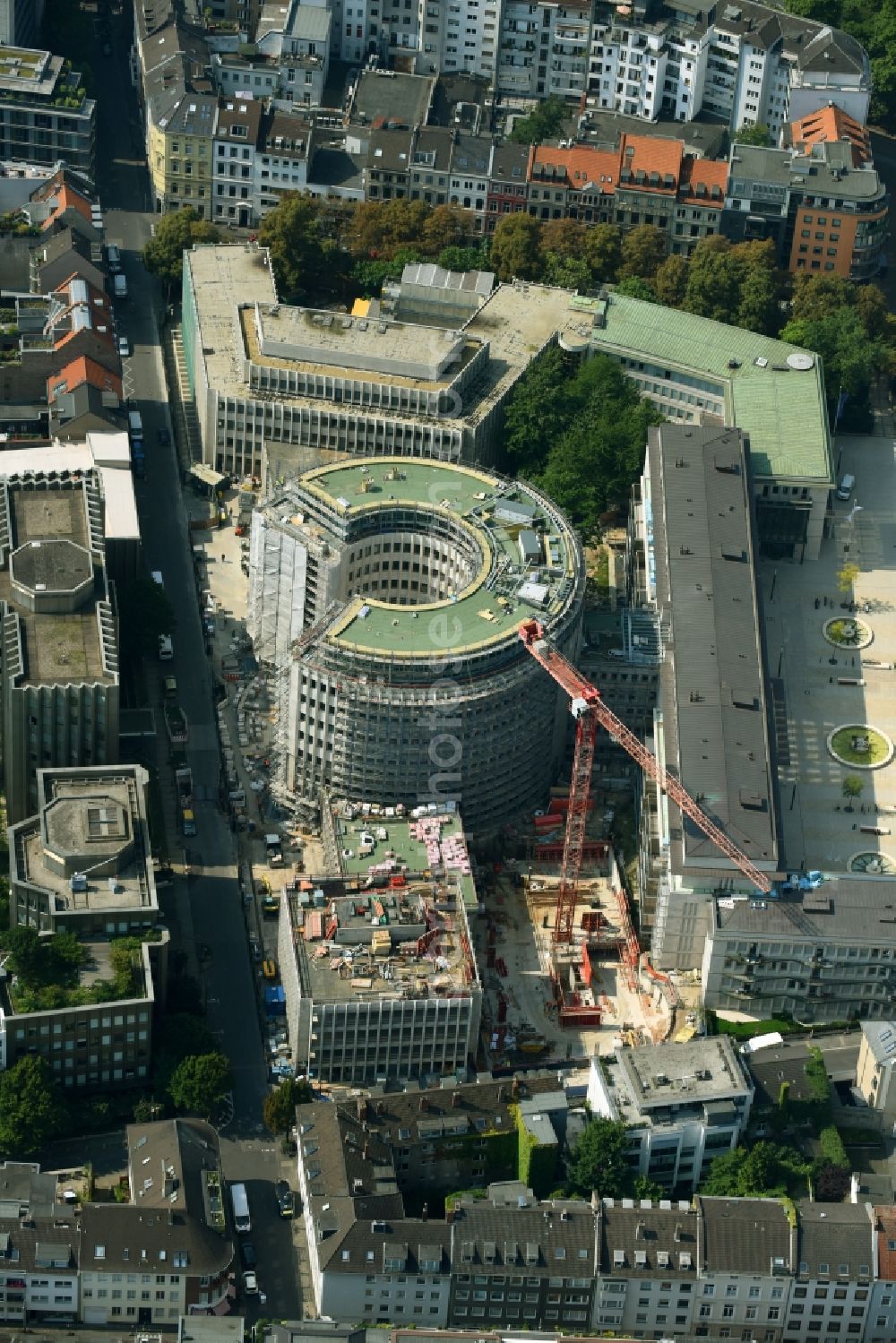 Köln from the bird's eye view: Construction site to build a new office and commercial building to the Revitalization and restoration monument - office buildings rotunda GQ1 and GQ23 Im Klapperhof in Cologne in the state North Rhine-Westphalia, Germany