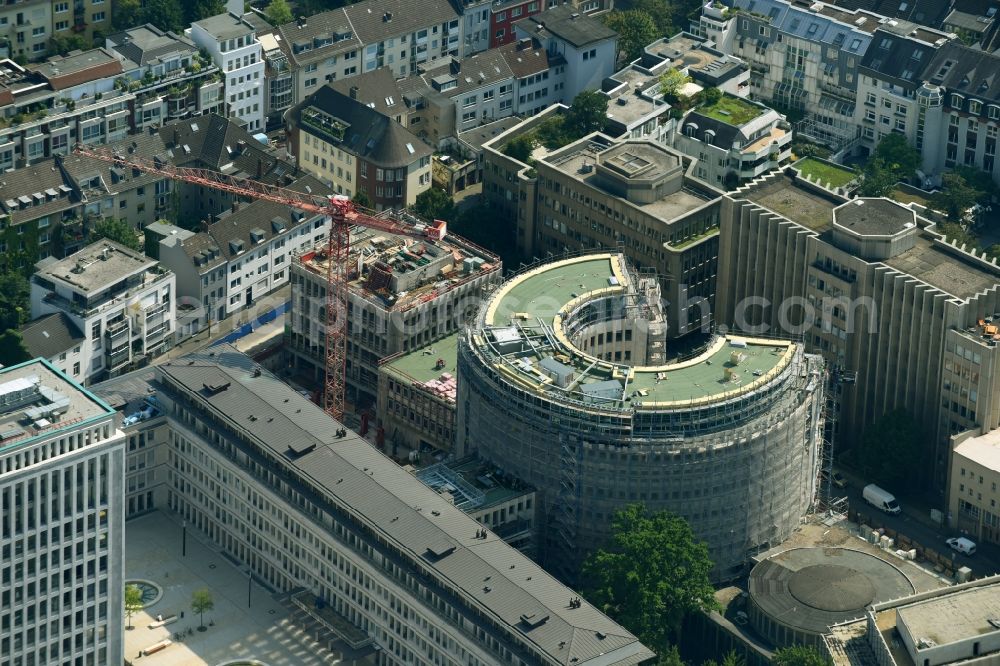 Köln from the bird's eye view: Construction site to build a new office and commercial building to the Revitalization and restoration monument - office buildings rotunda GQ1 and GQ23 Im Klapperhof in Cologne in the state North Rhine-Westphalia, Germany