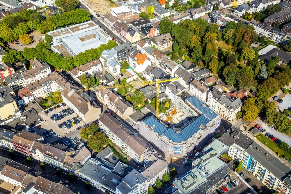 Velbert from the bird's eye view: Construction site to build a new office and commercial building between Oststrasse, Kurze Strasse and Koelverstrasse. The housing association company Velbert (WOBAU) is building the Stadthaus Velbert in Velbert in the state North Rhine-Westphalia