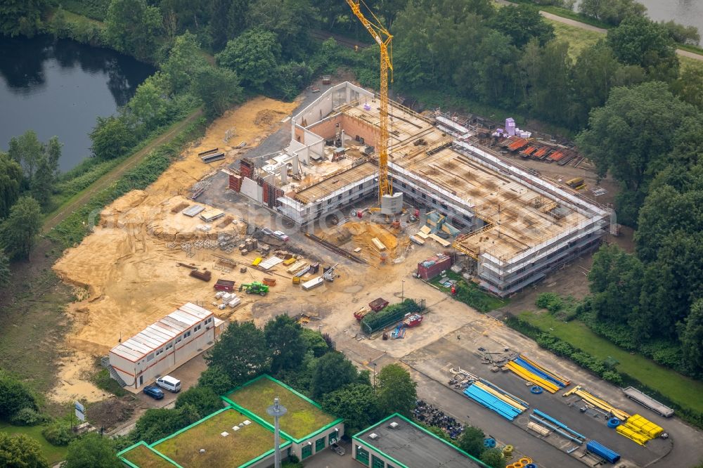 Hattingen from the bird's eye view: Construction site for a new Office building of Stadtwerke Hattingen GmbH on Weg zum Wasserwerk in Hattingen in the state North Rhine-Westphalia, Germany