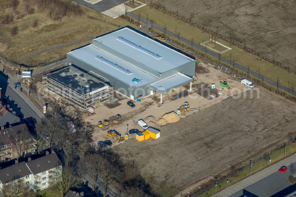 Aerial photograph Dinslaken - Construction site for the new building an office building, warehouse and assembly hall of Standby Pintsch GmbH on Huenxer Strasse in Dinslaken in the state North Rhine-Westphalia, Germany