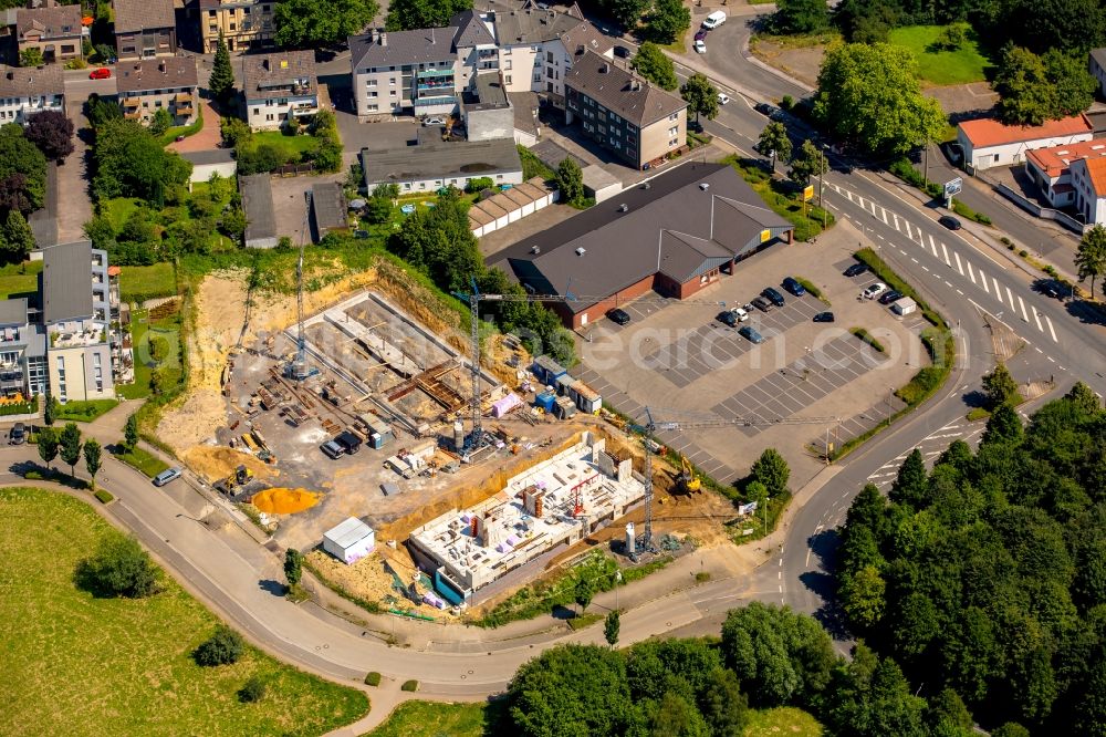 Witten from the bird's eye view: Construction site of a new office building complex next to the Netto supermarket branch on Rosi-Wolfstein-Strasse in the Annen part of Witten in the state of North Rhine-Westphalia