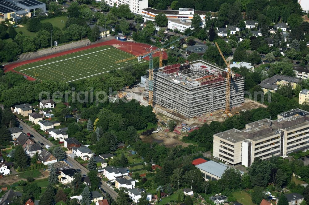 Aerial photograph Berlin - Construction for the new building of the campus building of Applied Sciences Sixth Form College (OSZ) Lise Meitner at the Lipschitzallee in Berlin. Behind the DeGeWo- Stadium