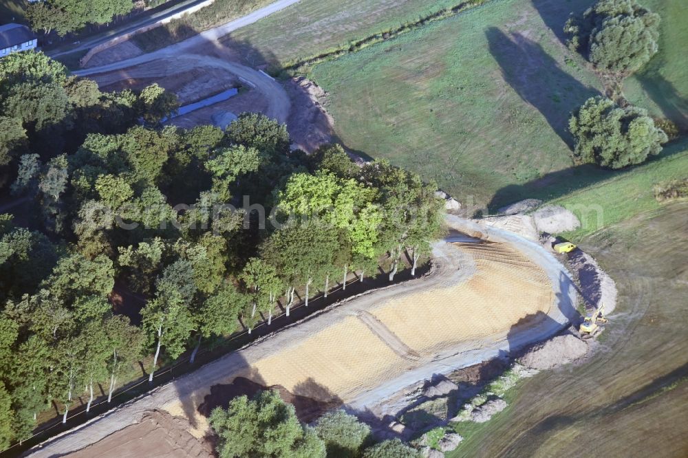 Aerial image Pretzsch (Elbe) - Construction site of a new levee at the castle park and palace of Pretzsch (Elbe) in the state of Saxony-Anhalt. The levee is being put in place for protection against flooding and high tide of the river Elbe