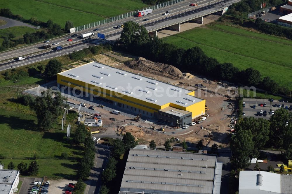 Aerial photograph Dresden - Construction site of a new logistics and DHL distribution center in the commercial area of Uebigau in the North of Dresden in the state of Saxony